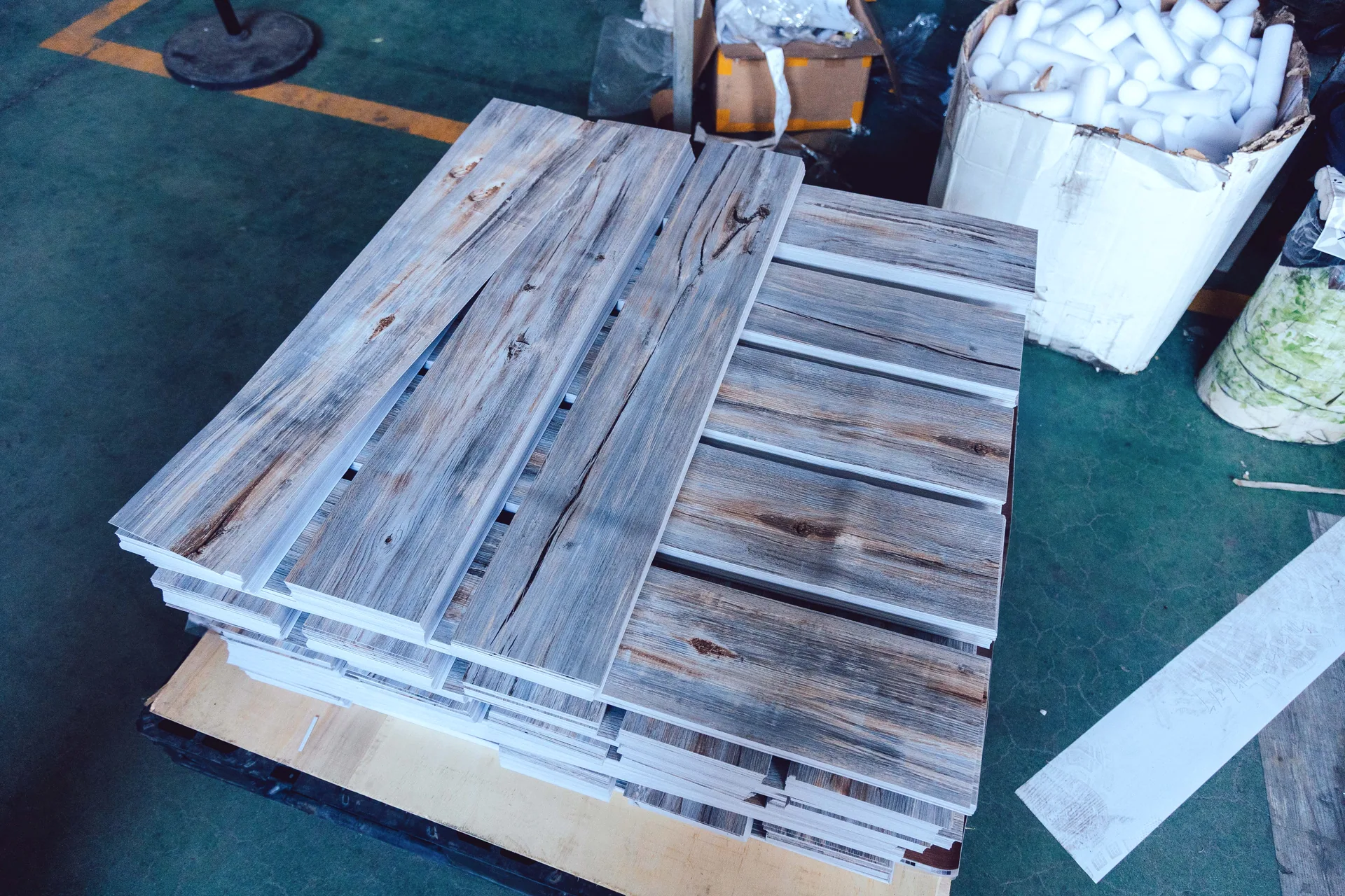 Finished wood-look PVC flooring prepared in the workshop
